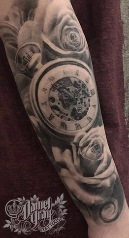 Pocket watch and roses on forearm, tattoo by cincinnati artist Daniel Gray